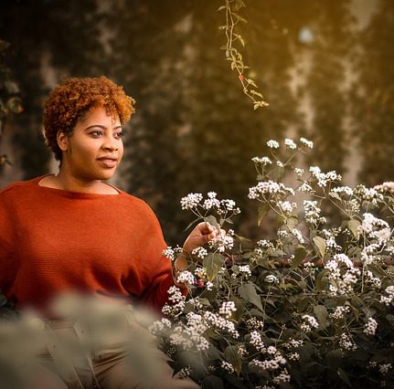 Portrait of Jessica Davis picking flowers